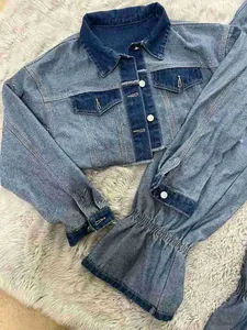 Close-up of casual color block denim jacket with cropped design and elastic cuffs