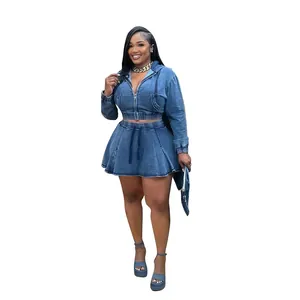 Full body view of a stylish washed blue denim jacket and pleated mini skirt set.