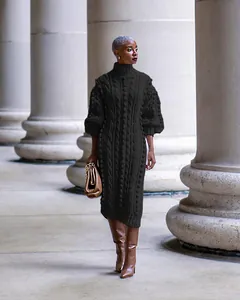 Elegant black cable-knit turtleneck maxi dress with textured pattern for autumn style.