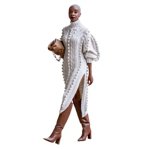 Elegant high-neck cable knit maxi dress with pom-pom details and side slits