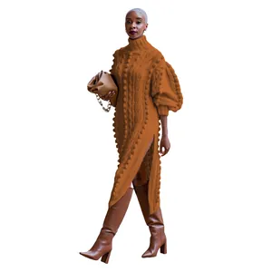 Close-up of caramel high neck knit dress with puffed sleeves and side slit detail