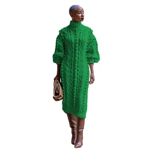 Close-up detail of women's green cable-knit turtleneck maxi dress with balloon sleeves