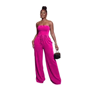 Vibrant washed magenta strapless wide-leg jumpsuit for women in a stylish casual fit