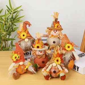 Group of decorative Thanksgiving scarecrow and gnome plush figurines for autumn harvest.