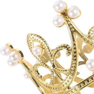 Close-up detail of golden alloy birthday crown with elegant pearl accents