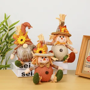 Three autumn harvest plush scarecrows and gnome dolls with sunflower and maple leaves.