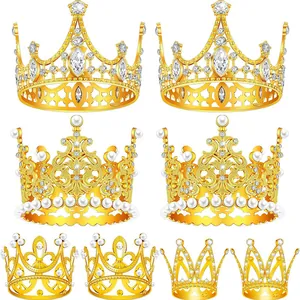Detailed view of assorted gold alloy crowns with sparkling crystals and white pearls.