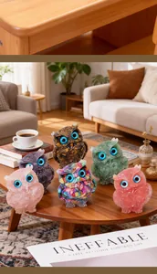 Group of handcrafted colorful crystal resin owl figurines displayed in a cozy home setting