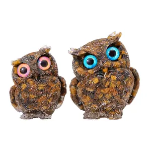 Handcrafted pair of owl resin figurines filled with natural tiger eye crystal gravel