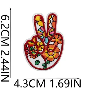 Detailed view of bohemian floral peace sign embroidery patch with size markers.