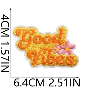 Detailed Good Vibes embroidered patch with pink flowers, measures 6.4 x 4 cm total