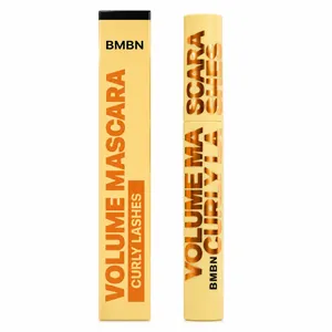 Close-up view of volume mascara tube and matching retail packaging in yellow and gold