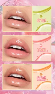Macro view of three glossy color-changing lip oil swatches and liquid textures