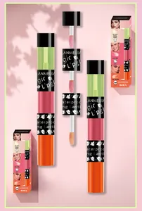 Macro detail shot of three color changing lip oil applicators and branded packaging box