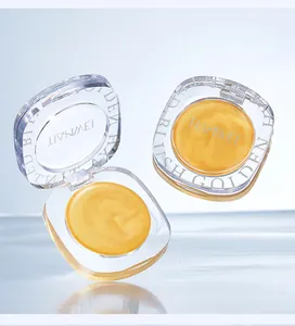 Detailed view of shimmering golden cream blush texture in a transparent acrylic compact