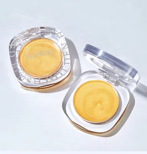 Close-up detail showing TIANWEI golden cream blush inside a clear acrylic square compact