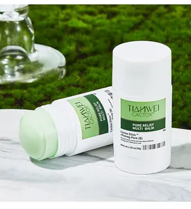 Close-up of Pore Relief Multi Balm stick showing pale green balm texture on moss background.