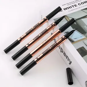 Detail shot of QICIY double-ended eyeliner and eyebrow pencil in rose gold finish.