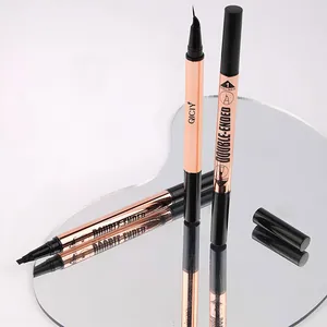Detailed close-up of QICIY double-ended eyeliner and 4-tip eyebrow pen on a mirror.