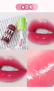 High-shine pink mirror lip glaze swatch showing detailed texture and product bottle