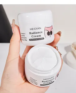 Close-up of MEIDIÁN Radiance Cream showing rich white texture and product label