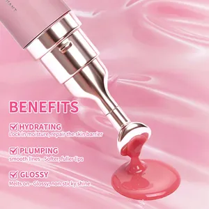 Close-up of lip gloss applicator dispensing glossy pink serum on textured background