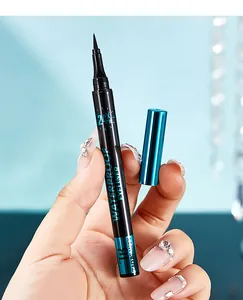 Close-up of Tao Beauty 24H waterproof black eyeliner pen held with manicured hand