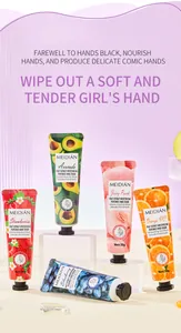 Close-up of five fruit-scented hand cream tubes displayed on white minimalist pedestals
