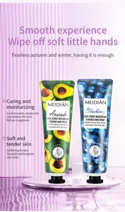 Detailed view of avocado and blueberry moisturizing hand cream tubes on purple background.