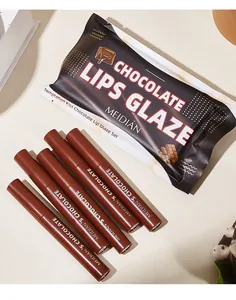 Close-up of Meidian chocolate lip glaze set with matte tubes and bag packaging