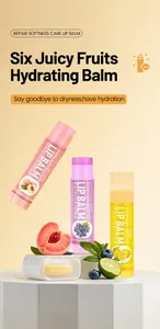 Close-up of BOSUYA lip balms with fresh fruit slices and moisturizing texture.