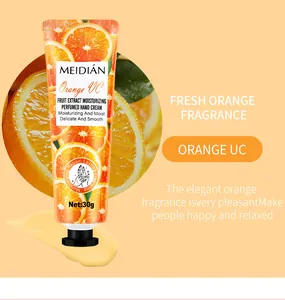 Macro detail of Meidian orange hand cream packaging and smooth moisturizing texture