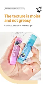 Detailed view of pink and blue BOSUYA moisturizing lip balm tubes held by a manicured hand
