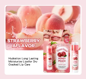 Close-up detail of honey peach scented lip balm packaging with moisturizing lip care results