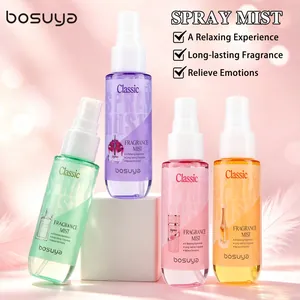 Detailed macro view of four colorful Bosuya alcohol-free fragrance spray bottles on a pink background