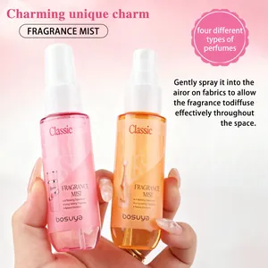 Detail of pink and orange Bosuya fragrance mist bottles for hair and body