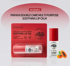 Detailansicht des Bosuya Papaya Lippenöls mit Verkaufsverpackung und frischer Papaya