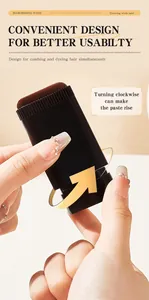 Close-up of black hair touch-up wand showing the rotation mechanism for the paste.