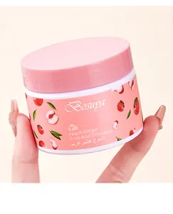 Detalle de la crema exfoliante de melocotón Bosuya en un tarro redondo rosa