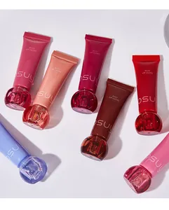Multiple shades of glossy jelly lip gloss tubes arranged on a clean white surface
