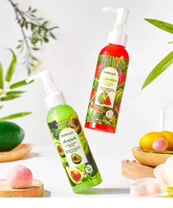 Detailed view of Bosuya avocado and watermelon exfoliating cream bottles with fruit props