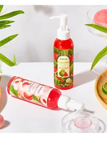Detail of Bosuya fruit exfoliating body cream with pink gel texture and pump packaging.