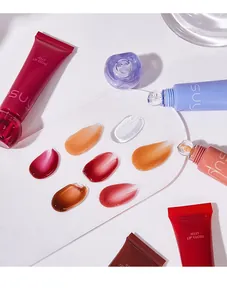 Close-up view of multi-color hydrating jelly lip gloss texture swatches on a plate