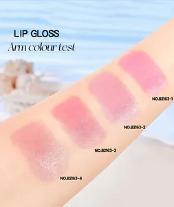 Detailed arm color swatches showing four shades of shimmer pink lip gloss and oil