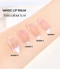 Detailed macro arm swatches of four pearlescent lip oil shades with high-shine glitter finish