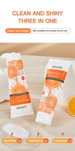 Detalle de los tubos de limpiador facial de vitamina C y textura del producto en plato