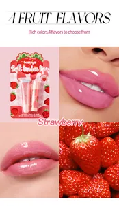 Strawberry lip gloss and color-changing balm set showing pink texture on lips and packaging.