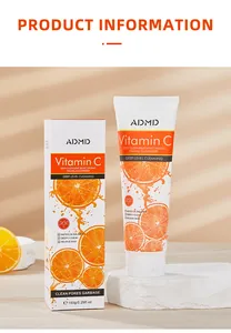 Detalle del limpiador facial ADMD Vitamina C con su caja sobre soporte de piedra