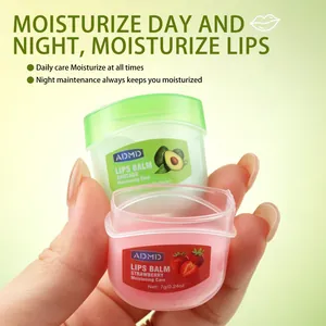 Close-up of ADMD strawberry and avocado moisturizing lip balm jars for daily lip care