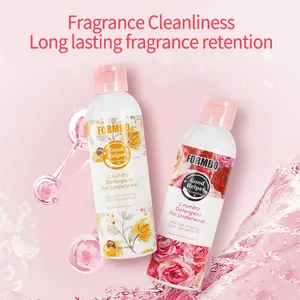 Close-up of FORMBO floral underwear laundry detergent bottles on pink splash background